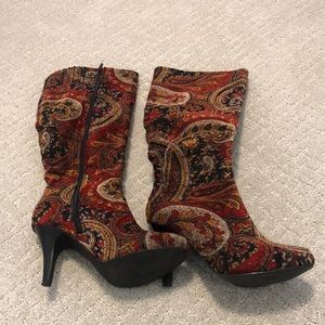 Diba high heeled mostly red boots.